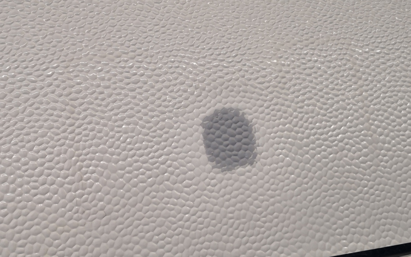 Ausgebesserte Stelle auf der Seitenwand